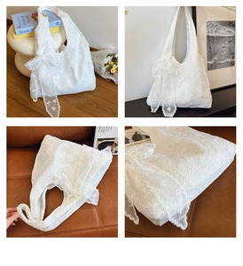 Close-up of white floral lace tote bag featuring a large bow and wavy scallop edges