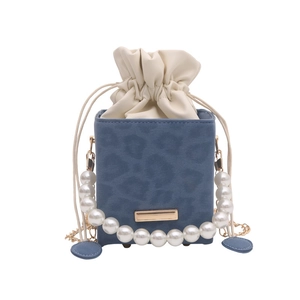 Blue leopard print bucket bag with pearl handle and cream drawstring lining