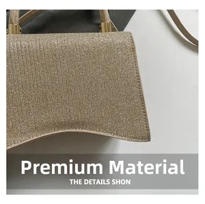 Close-up of golden glitter fabric texture and curved bottom detail with metal hardware