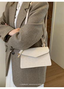 Minimalist white rectangular envelope shoulder bag with a sleek retro vibe and metal buckle
