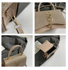 Detail of sequin mini bag with curved bottom, golden letter clasp and elegant handle