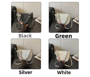 Collage de sacs sous les bras chics en noir, vert, argent et blanc avec nœud en perles