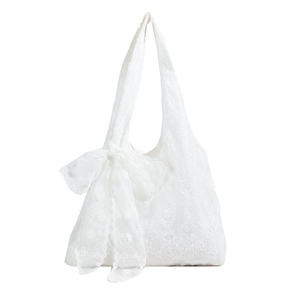 Elegant white embroidered lace tote bag with a large tulle bow decoration on plain white background