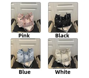 Quilted tote bags in pink, black, blue, and white with bow embroidery details