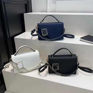 Chic women's leather square handbags in navy, white, and black with metal buckle detail