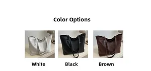 Detail view of large tote bags in white black and brown with textured grid pattern