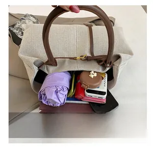 Top-down view of large canvas tote bag interior showing capacity for daily essentials