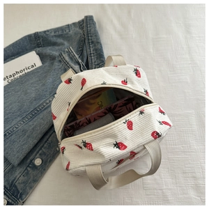 Detailed top view of strawberry print corduroy lunch bag with spacious zipper opening