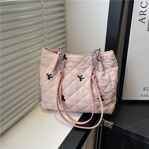 Pink quilted tote bag with black bow embroidery and silver chain strap for women