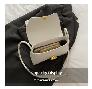 Detailed internal view showing large capacity for smartphone and wallet in white bag