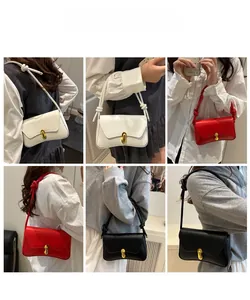 Detail view of structured handbags with gold oval locks and twisted strap accents in three colors