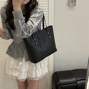 Black large capacity faux crocodile tote bag with gold studs and slender shoulder straps
