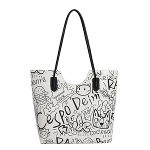 Large white tote bag with black graffiti print and slim shoulder straps for daily use