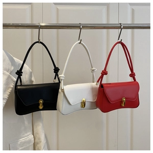 Detailed comparison of minimalist shoulder bags in black, white, and red with gold buckles