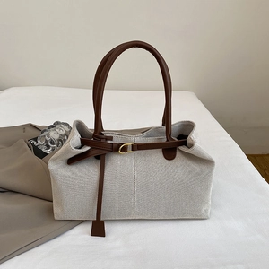Retro canvas tote bag with brown leather trim and golden buckle for daily commute