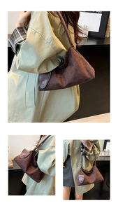 Detail of brown suede shoulder bag with twisted leather strap and crescent shape design
