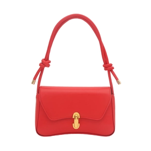Minimalist red leather shoulder bag with wavy base and gold clasp on white background