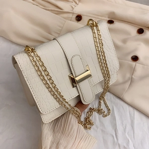 White croc-effect flap shoulder bag with gold square lock and chain strap on fabric back