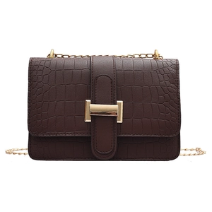 Dark brown faux leather crossbody bag with crocodile pattern and golden H-buckle