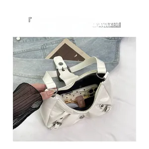 Top view of white pleated bag interior showing large capacity for phone and cosmetics