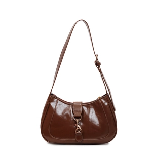 Polished dark brown crescent underarm bag with adjustable strap and metal buckle detail