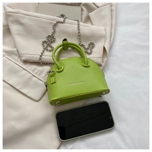 Mini shell bag in litchi grain leather with bead chain and phone for size reference
