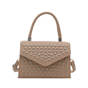 Beige envelope clutch with silver studs, top handle and detachable shoulder strap