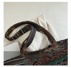 Detailed view of woven ethnic patterns and sturdy handles on the retro tote bag