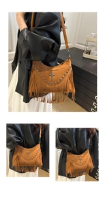 Detailed view of brown suede tote bag with metallic studs, cross charm and fringe tassels