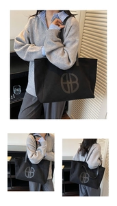 Detailed views of a large black vintage tote bag with logo on smooth fabric finish