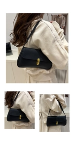 Detailed view of black lychee texture leather underarm bag with gold metal buckle