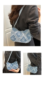 Detail of Y2K denim crossbody bag with star print and distressed frayed edges