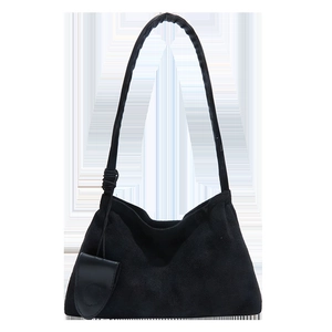 Minimalist black suede underarm bag with matching oval pendant and long shoulder strap
