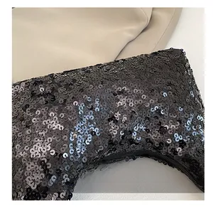Detailed macro shot of high-quality shiny black sequins on a fashionable shoulder bag