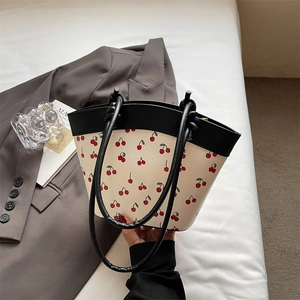 Chic tote bag with red cherry prints and black handles for women's autumn fashion