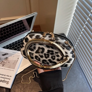 Chic leopard print crossbody bag with gold U-shaped handle and metal chain strap