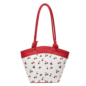 Minimalist white leather bucket bag with red cherry prints and red knotted handles