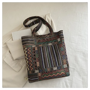Macro detail of the woven geometric jacquard texture and colorful patterns on the tote bag