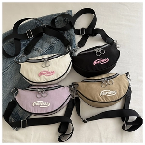 Close-up of four canvas chest bags in white, black, purple, and khaki with embroidered logo