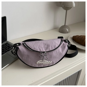 Detail of lavender nylon half-moon bag with FANYISSA embroidery and silver zippers