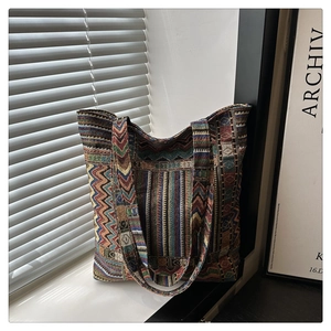 Macro detail of bohemian geometric knit texture and woven colorful canvas tote bag straps