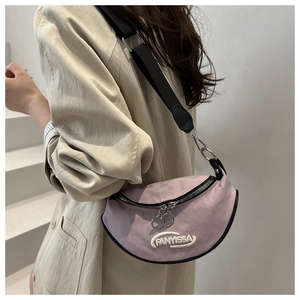 Close-up of lilac crescent crossbody bag with FANYISSA embroidery and dual zippers