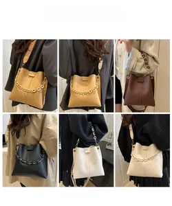Chic bucket bags in various colors showing cross-body wear with chain and woven straps