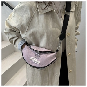 Detail of purple crescent shoulder bag with FANYISSA embroidery and black nylon strap