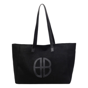 Minimalist black tote bag with large AB logo and spacious interior for daily commute