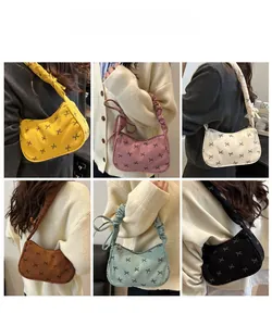 Detailed grid view showcasing corduroy shoulder bags with black bow prints in six colors