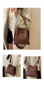 Detail of brown leather bucket bag with amber chain and geometric woven strap