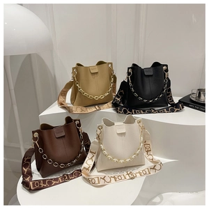 Chic bucket bags in four colors featuring pebble leather and resin chain details
