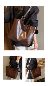 Close-up of brown leather tote bag showing vintage texture and white brand logo detail