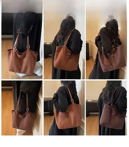 Multi-angle weergave van een bruine suède tote bag met goudkleurige metalen accenten